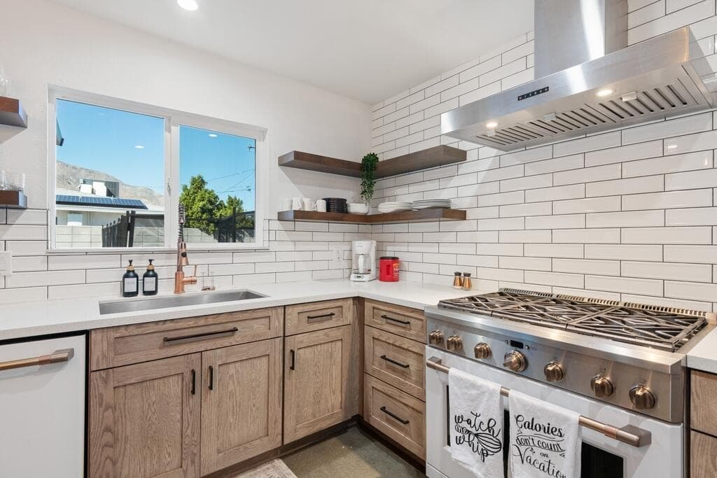 Remodeled kitchen with subway tile and floating shelves